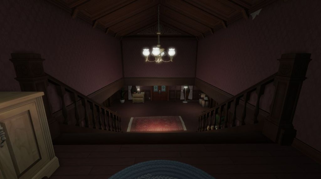 Looking down the stairs to the front entryway and door.